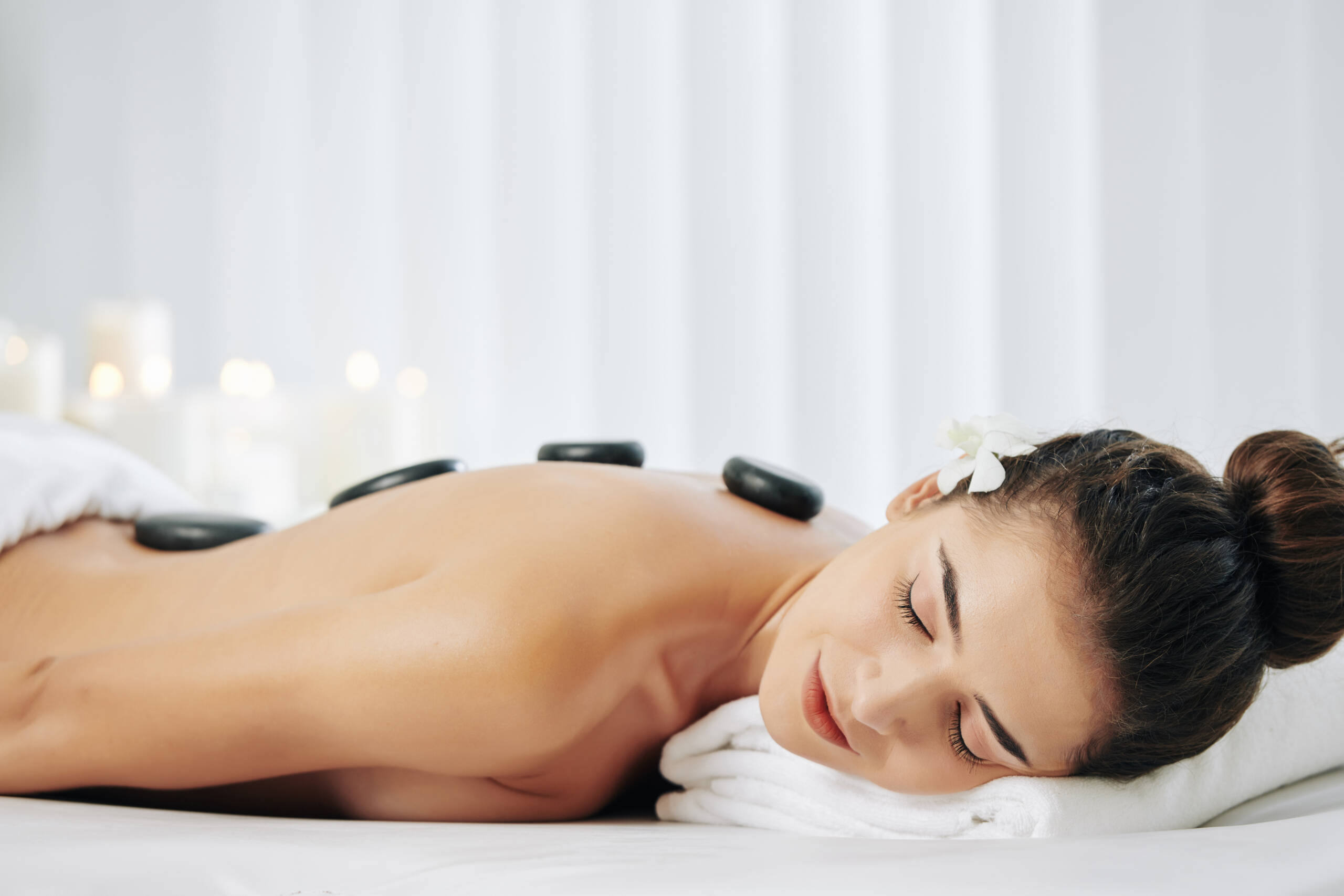 Break the tension with a Hot Stone Massage at Esther's Wellhouse